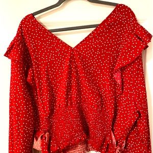 Red V-neck blouse.